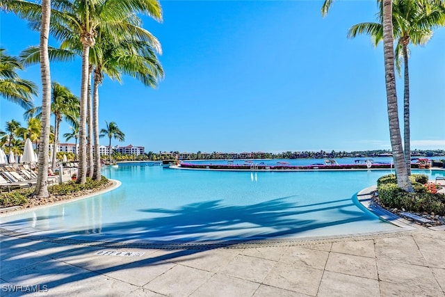 view of pool featuring a water view