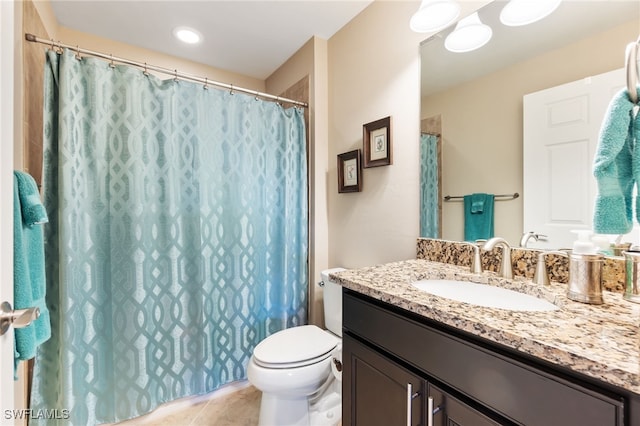 bathroom featuring vanity, toilet, a shower with curtain, and tile patterned floors