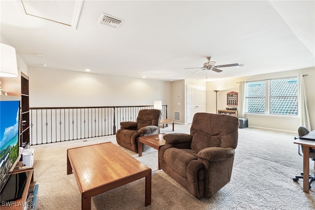 living room featuring carpet flooring and ceiling fan