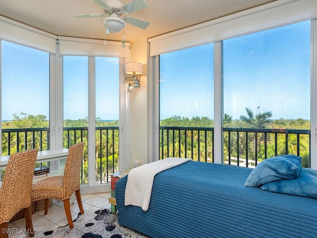 bedroom with ceiling fan and light tile patterned flooring