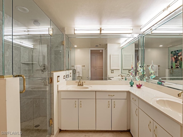 bathroom featuring vanity and walk in shower