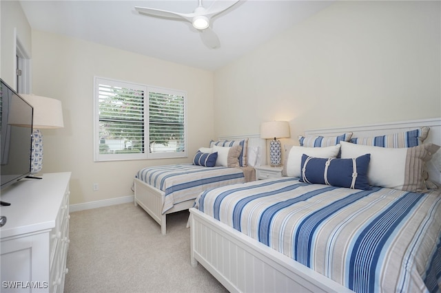 bedroom featuring light carpet and ceiling fan