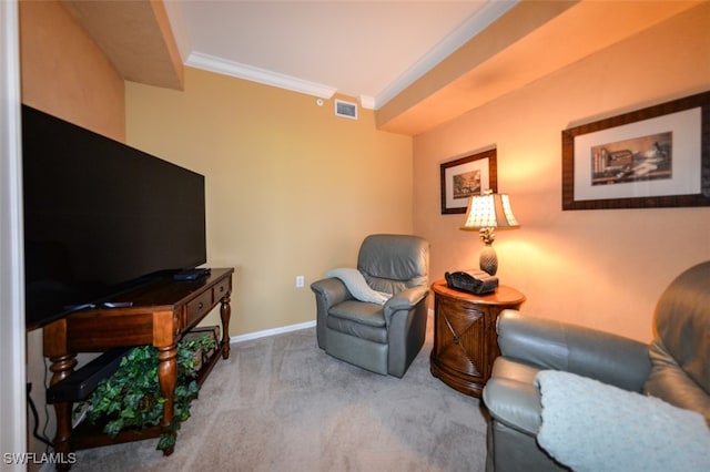 sitting room featuring light colored carpet and ornamental molding