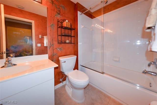 full bathroom featuring combined bath / shower with glass door, vanity, tile patterned floors, and toilet