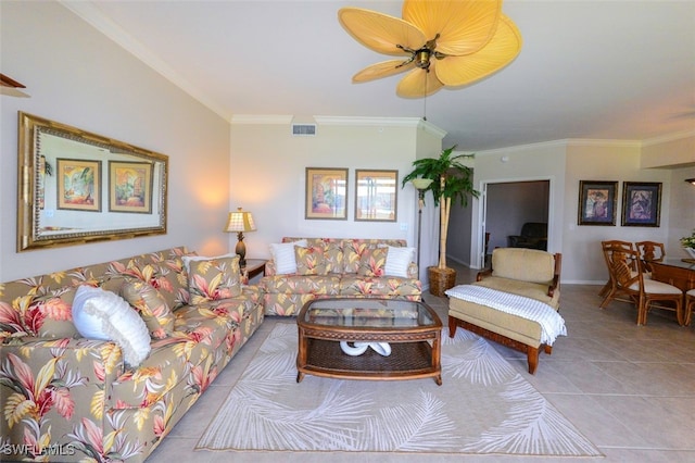 living room with crown molding, light tile patterned flooring, and ceiling fan