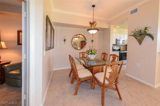 dining space with crown molding and light tile patterned flooring