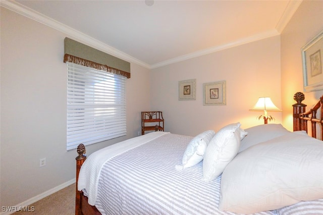 bedroom featuring ornamental molding and carpet flooring