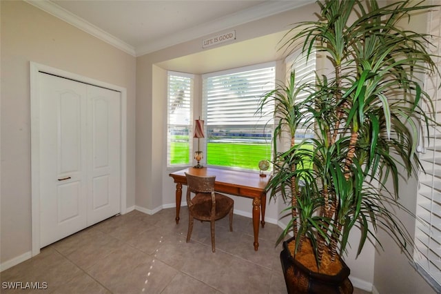 office area with ornamental molding and light tile patterned flooring