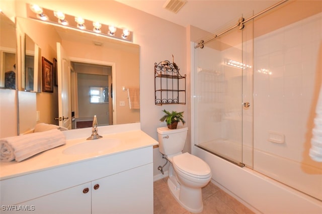 full bathroom featuring tile patterned flooring, enclosed tub / shower combo, vanity, and toilet