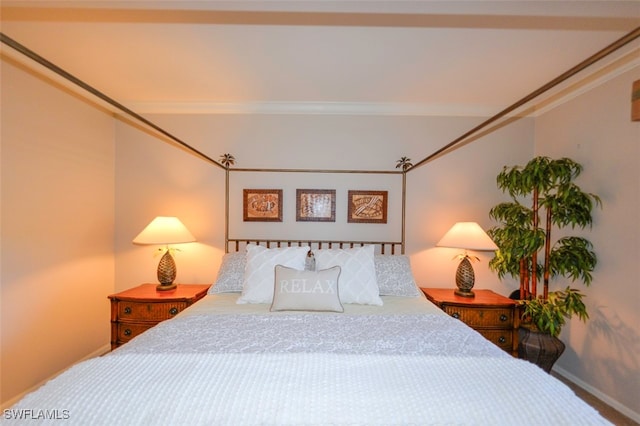 bedroom with ornamental molding