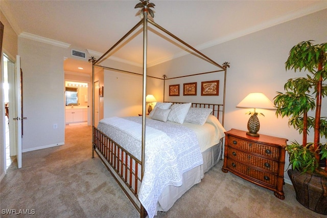 carpeted bedroom with connected bathroom, sink, and crown molding