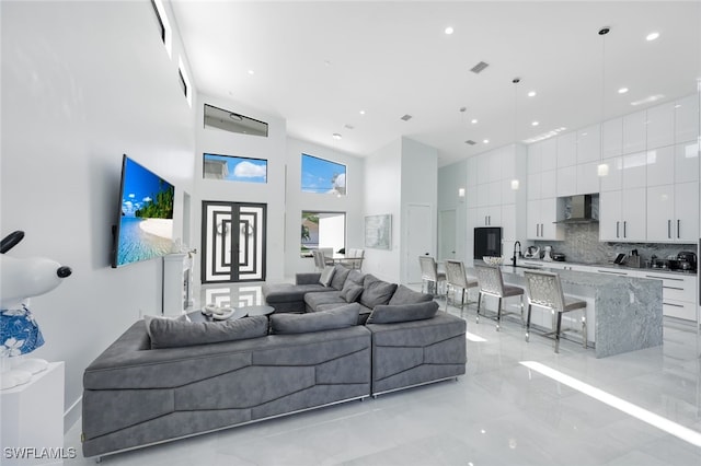 living room with a towering ceiling