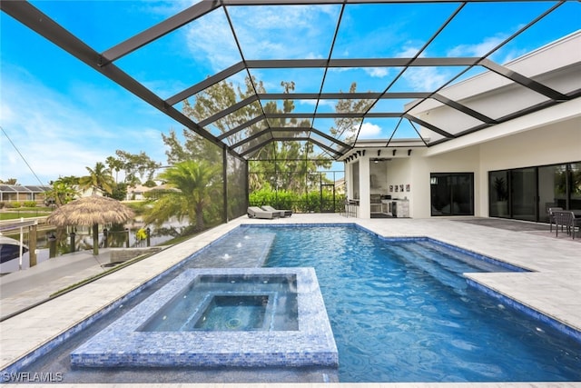 view of pool with a lanai, a water view, an in ground hot tub, and a patio area