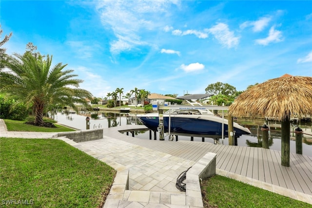 view of dock featuring a yard and a water view