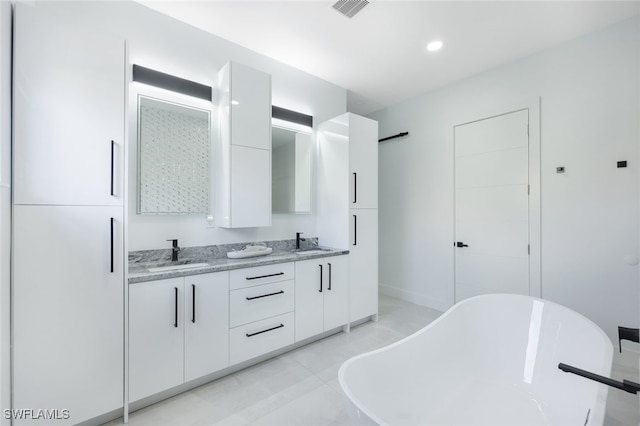 bathroom featuring vanity and a bathing tub