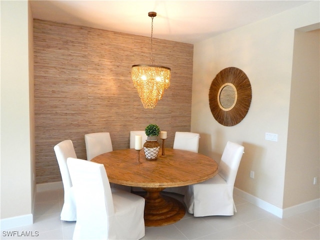 unfurnished dining area with light tile patterned floors and a notable chandelier