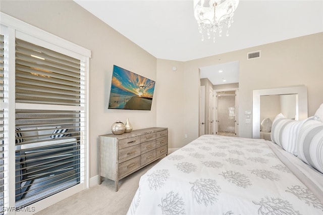 bedroom with light carpet and a chandelier