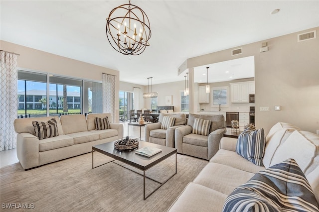 living room featuring a notable chandelier