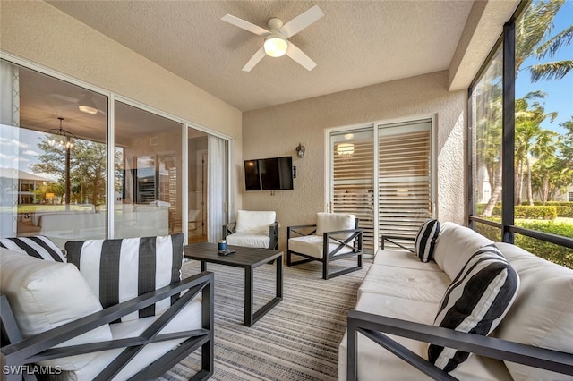 sunroom with ceiling fan and a healthy amount of sunlight