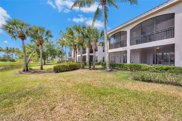 view of property's community with a lawn