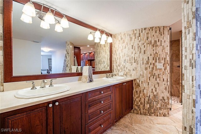 bathroom featuring tile walls, walk in shower, and vanity