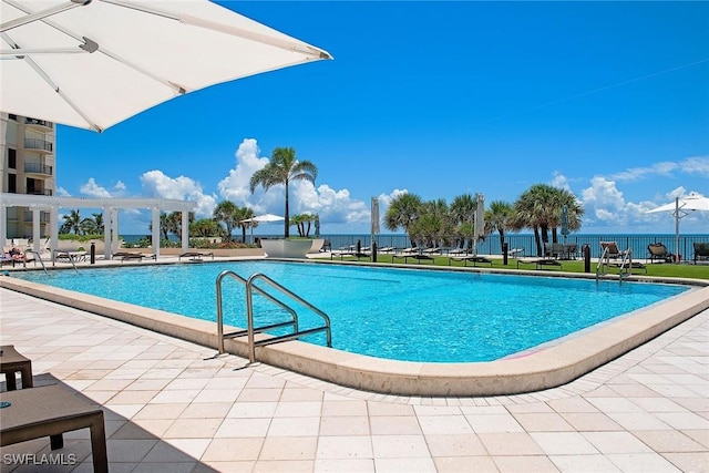 community pool with fence, a pergola, and a patio