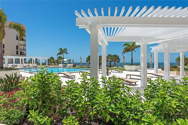 view of pool with a patio and a pergola