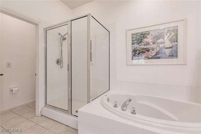 bathroom featuring plus walk in shower and tile patterned floors