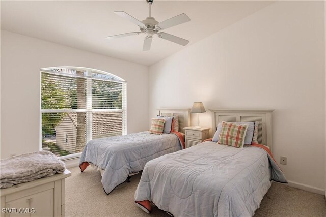 carpeted bedroom with lofted ceiling and ceiling fan