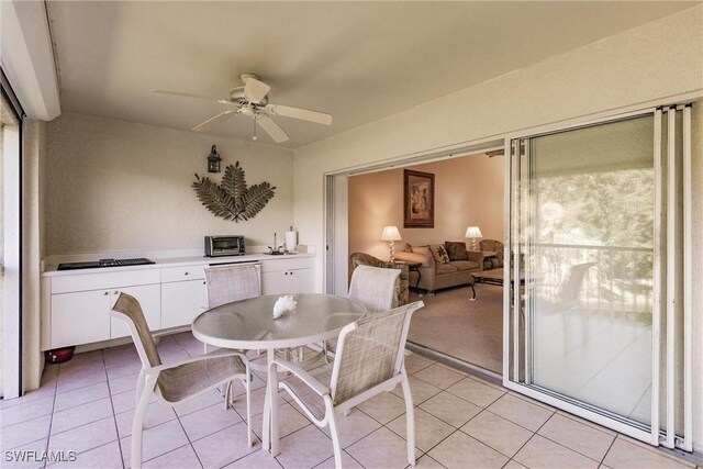 tiled dining room featuring ceiling fan