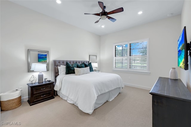 bedroom featuring light carpet, recessed lighting, a ceiling fan, and baseboards