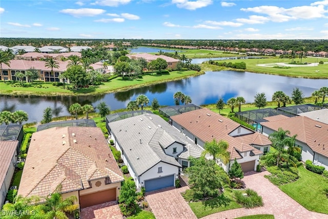 drone / aerial view featuring a water view and a residential view