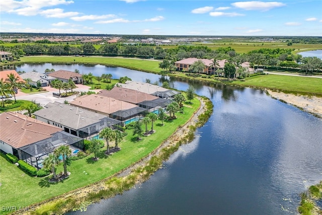 birds eye view of property featuring a water view and a residential view