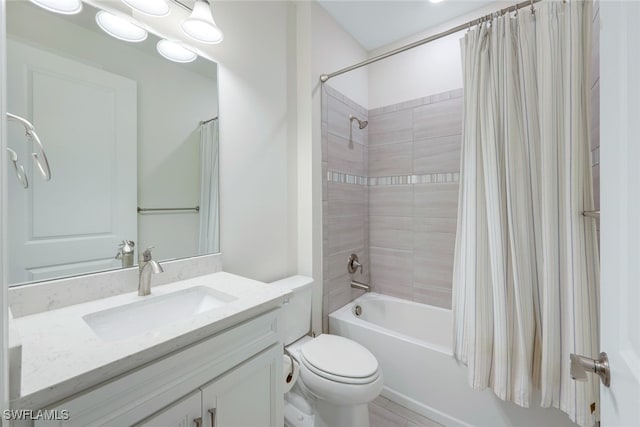 bathroom with toilet, shower / bath combination with curtain, and vanity