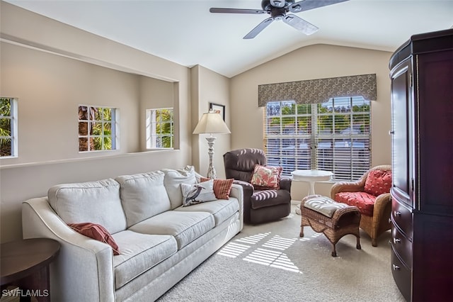 carpeted living room featuring ceiling fan and lofted ceiling