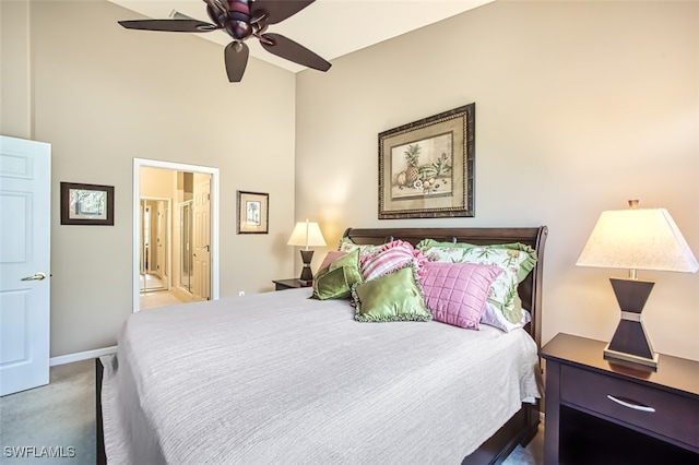 carpeted bedroom with connected bathroom and ceiling fan