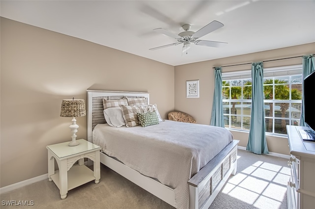 bedroom featuring ceiling fan and light colored carpet