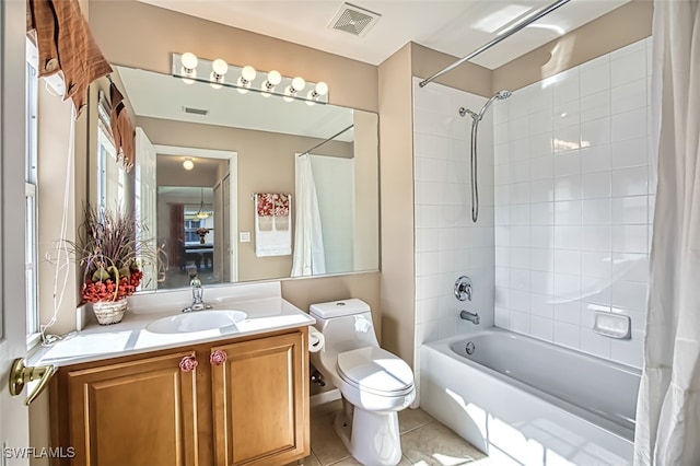 full bathroom featuring vanity, tile patterned flooring, toilet, and shower / bath combo