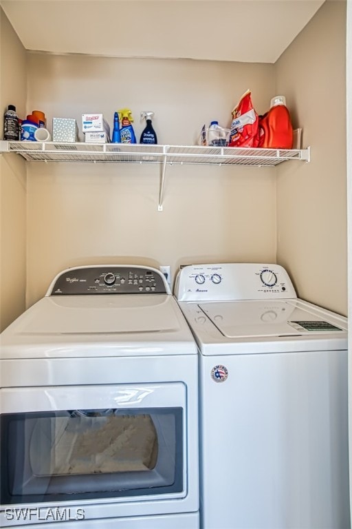 clothes washing area featuring washing machine and dryer