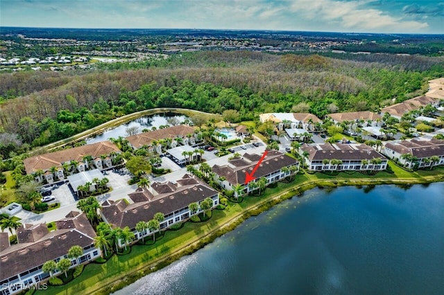 birds eye view of property with a water view