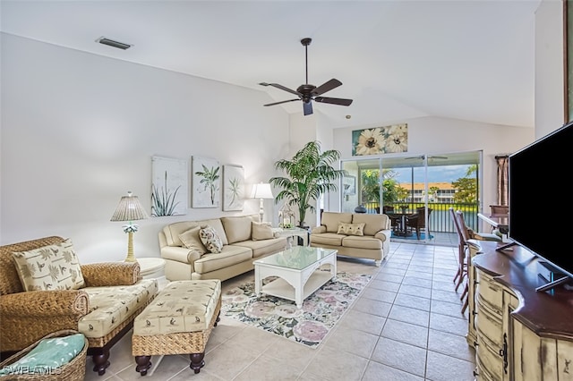 living room with ceiling fan, light tile patterned floors, and high vaulted ceiling