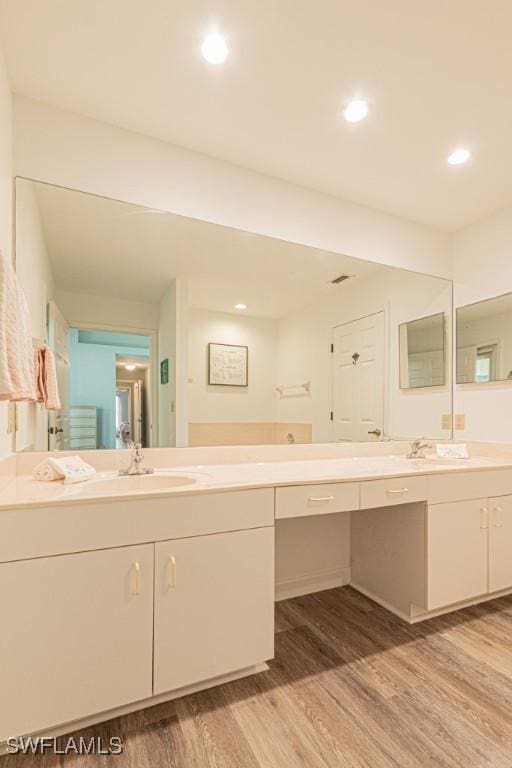 25202 Golf Lake Cir, Bonita Springs, FL 34135 - full bath featuring recessed lighting, wood finished floors, and vanity