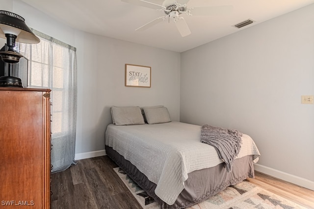 bedroom featuring ceiling fan and dark hardwood / wood-style floors