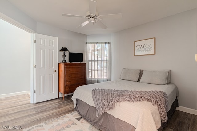 bedroom featuring light hardwood / wood-style flooring and ceiling fan