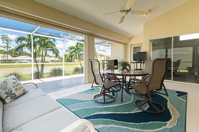 sunroom / solarium with lofted ceiling and ceiling fan