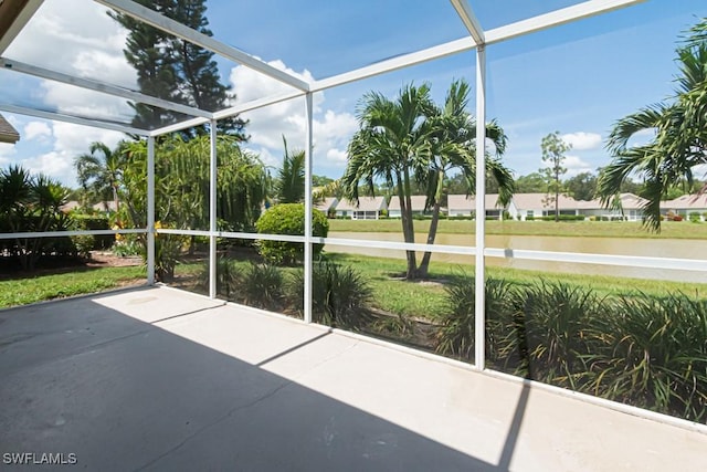 25202 Golf Lake Cir, Bonita Springs, FL 34135 - unfurnished sunroom with a water view