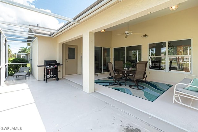 25202 Golf Lake Cir, Bonita Springs, FL 34135 - view of patio featuring glass enclosure, area for grilling, and a ceiling fan