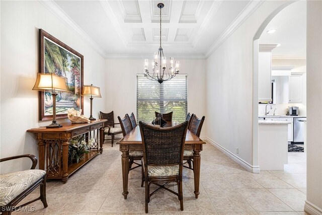 dining room with beamed ceiling, light tile patterned flooring, ornamental molding, coffered ceiling, and a notable chandelier