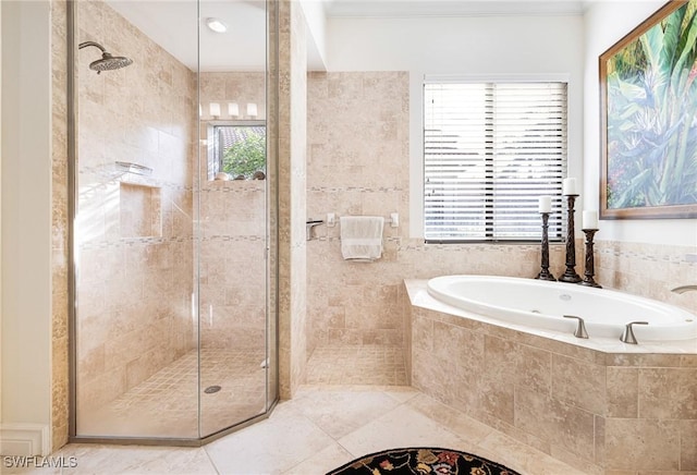 bathroom with separate shower and tub and tile patterned floors