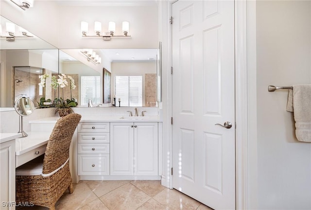 bathroom featuring crown molding, vanity, and tile patterned floors